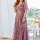 Manuela | Vestido de noite longo, romântico e cintilante com decote em V e tiras